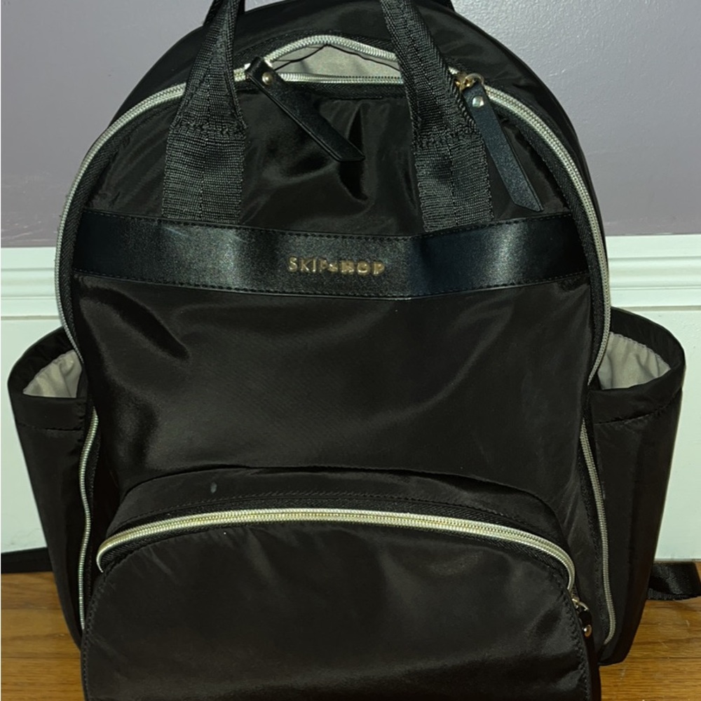 Skip hop diaper backpack. Great storage and easy to organize all the baby things